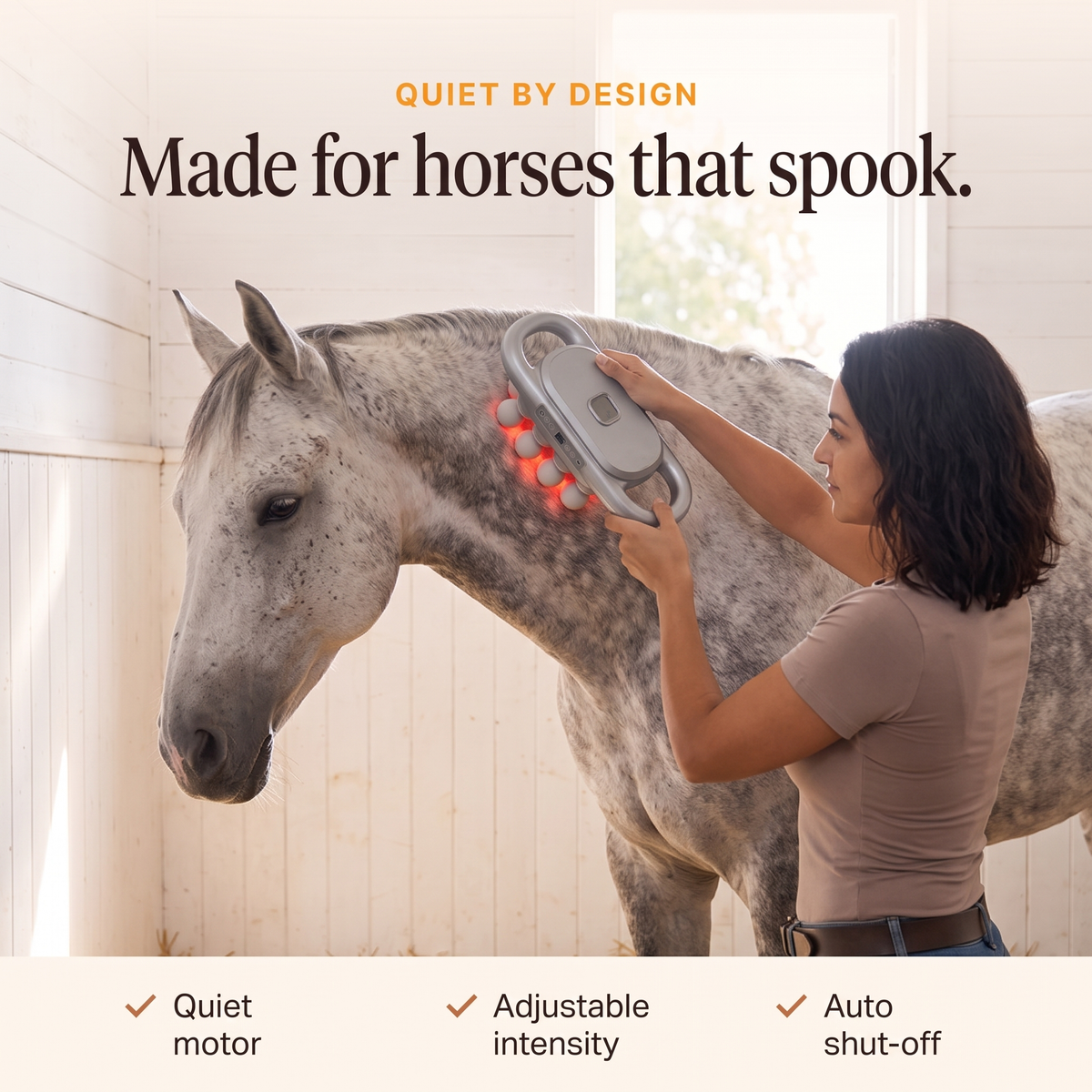 Dappled gray horse standing quietly while a woman uses the quiet RedHoof massage gun on its neck, adjustable intensity, auto shut-off